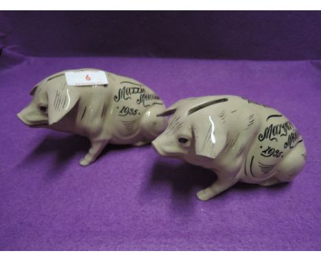 Two ceramic salt glazed pig or money banks dated 1935 both have age relate wear