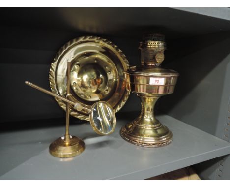 A selection of brass wares including spy glass and oil lamp
