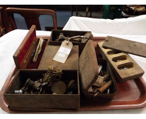 A selection of watch makers tools, fixtures and fittings etc
