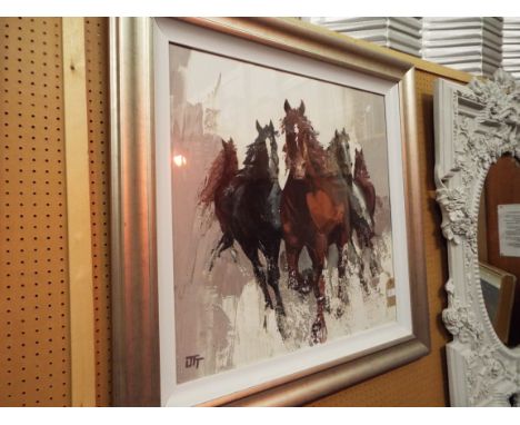 A large art print of horses in gallop, initialled in print below, framed