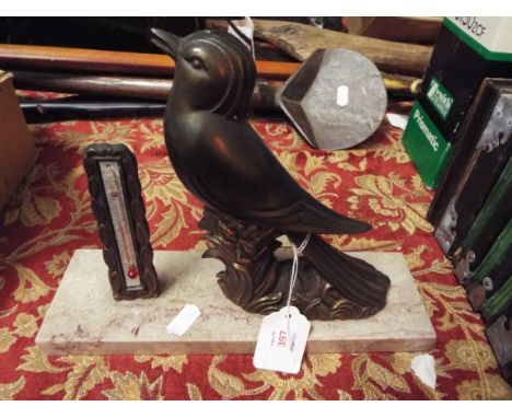 An Art Deco bronzed bird resting on a marble plinth with thermometer 