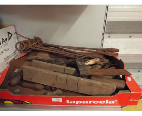 A selection of vintage tools to include branding irons, set square, anvil, files, knives etc