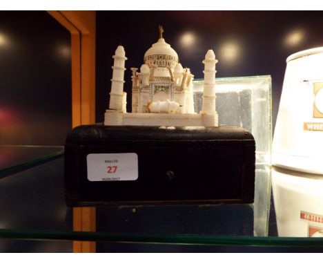 A 19thC Indian alabaster hardstone carved model of the Taj Mahal in glass case with light box beneath  