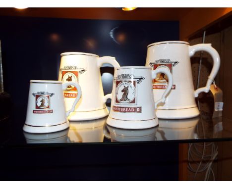 A graduated set of ceramic Whitbread brewery tankards 