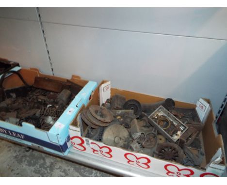 A selection of cogs, gears, wheels, pistons, possibly from a steam engine in two boxes