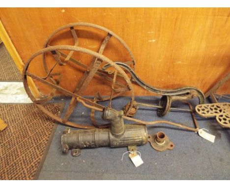 An early 20thC cast iron water pump with iron motif together with a vintage hose reel