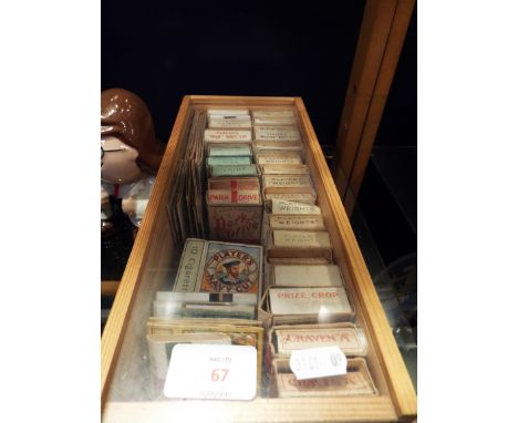 A display box of assorted vintage cigarette packets
