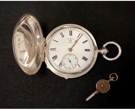 A George V silver hunter cased military pocket watch, Rotherham's London, white enamel dial, bold Roman numerals, minute trac