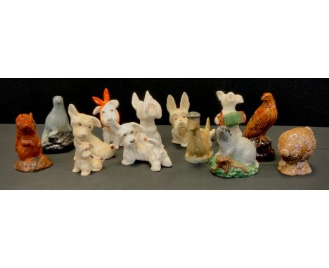 A Beswick figure, Toothache Terrier, others Ladybird Tail, Ladybird Nose , concertina player etc, wade novelty liquor flasks 