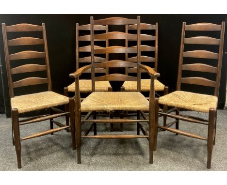 A set of five late 19th century ladder back rush seated dining chairs, comprising four chairs, and a single carver chair, the