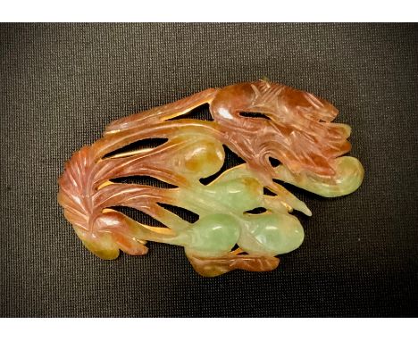 A Chinese carved hardstone and jade table brooch, as a cluster of Animals and Foliage, in tones of brown and green, yellow me