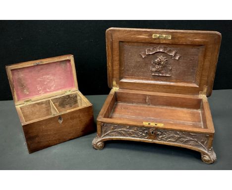 A late 19th century carved oak cigar box, c.1900; a George III mahogany rectangular tea caddy, c.1810 (2) 