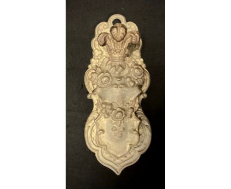 A 19th century gilt brass letter clip, embossed with the flowers of the Union, Prince of Wales feathers and Irish harp 