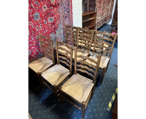 EIGHT OAK LADDER BACK CHAIRS