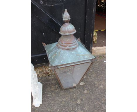 A Victorian copper street lantern top with four glass panels (one missing) with plaque, "Hoddesdon, D W Windsor, Herts, Engla