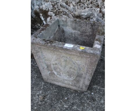 A cast stone square tapering planter with Prince of Wales feather decoration, 14" wide