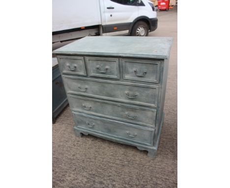 A grey/green sponge painted chest of three short and three long drawers, on bracket supports, 36" wide x 22" deep x 39" high