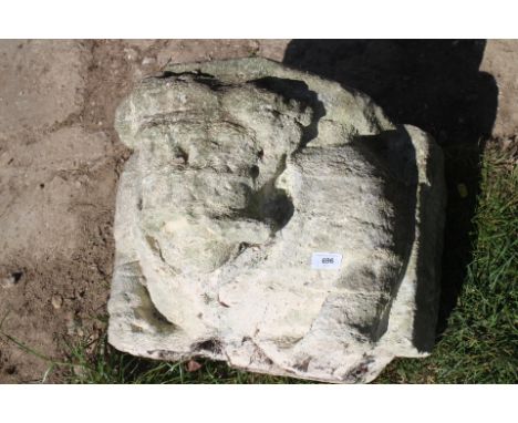 A medieval carved stone corbel with male figure portrait design, 17" wide
