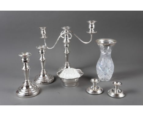 A three-light silver plated table candelabra, two similar candlesticks and other plate