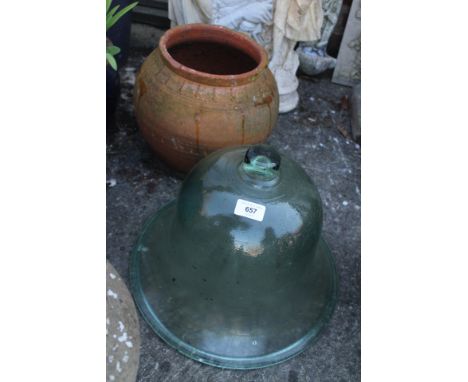 A moulded glass cloche and a terracotta planter 