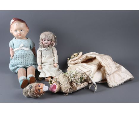 A Simon & Halbig porcelain headed doll, back of neck with impress marks, "S&H 1249 DEP Germany Santa", 4 1/2" x 14" high, a w