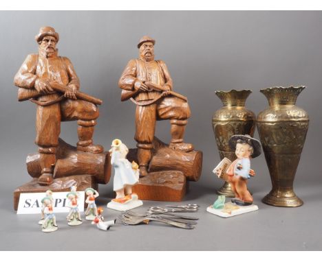A number of German ceramic figures, a pair of German carved wood figures of huntsmen and other decorative items