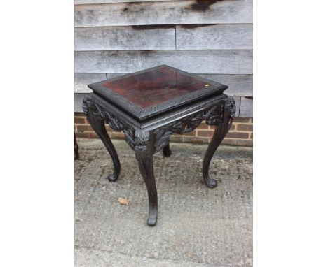 A Chinese carved hardwood centre table with blind fretwork, on cabriole supports, 27" square x 29" high