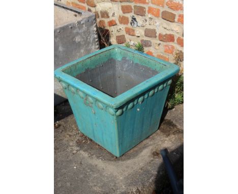 A turquoise glazed ceramic square-section planter, 19" wide