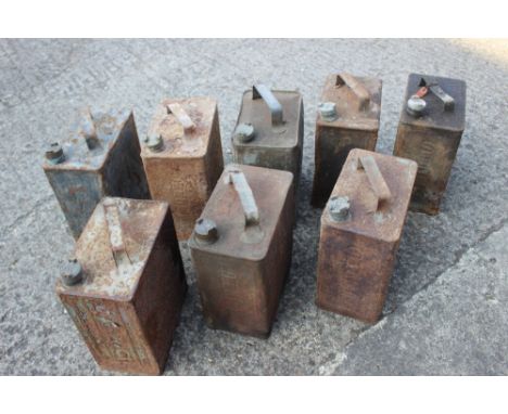 Eight vintage oil cans, by Esso, Pratts and other (all weathered and rusted