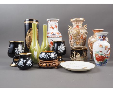A Japanese Satsuma bulbous vase with panelled figure and landscape decoration, on three supports, 6 3/4" high, another simila