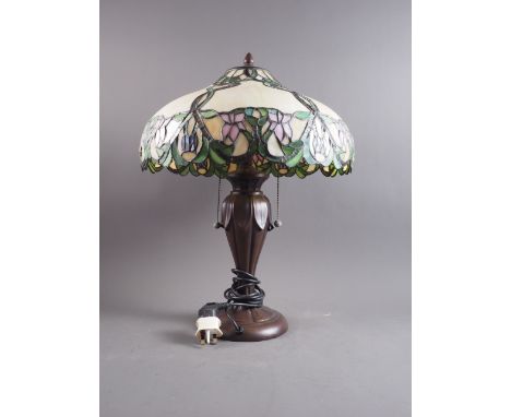 A well produced Tiffany style table lamp, on leaf work base, 22" high