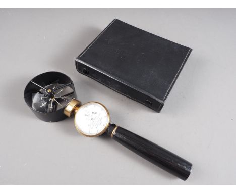 A Negretti and Zambra anemometer with brass and black Japanned finish, in fitted case