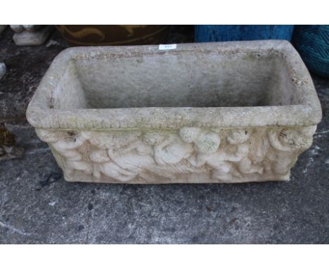 A cast stone rectangular planter with relief cherub decoration, 21 1/2" wide