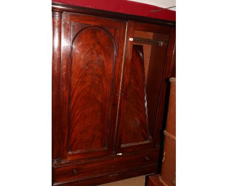 A late 19th century mahogany wardrobe enclosed two doors over one long drawer, on block base, 56" wide x 23" deep x 75" high