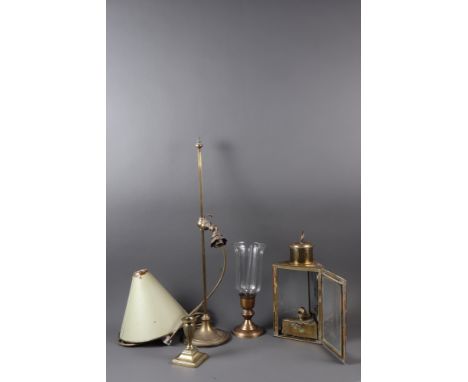 A triangular shaped brass cased lantern, 11 1/2" high, an adjustable brass table lamp, two candlesticks and a storm lamp shad