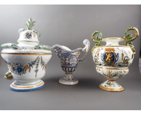 A French faience pottery eel jar, 17" high, a similar urn with snake handles, and a similar jugCondition:Jug is fine.The snak
