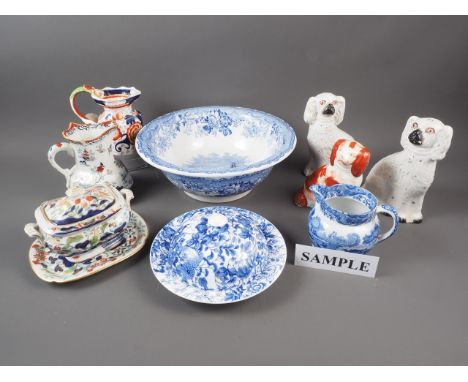 A Spode Italian jug, a Masons blue and white toilet bowl, a pair of Staffordshire spaniels, another similar, an Ironstone jug