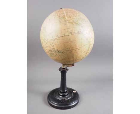 A 19th century German terrestrial globe, on ebonised stand, inset compass, 13 1/2" high (wormed stand)