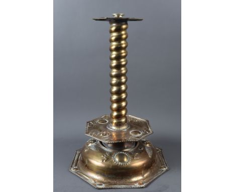 A brass candlestick with embossed decoration and spiral twist stem, on octagonal base, 18 1/2" high (converted to a lamp)