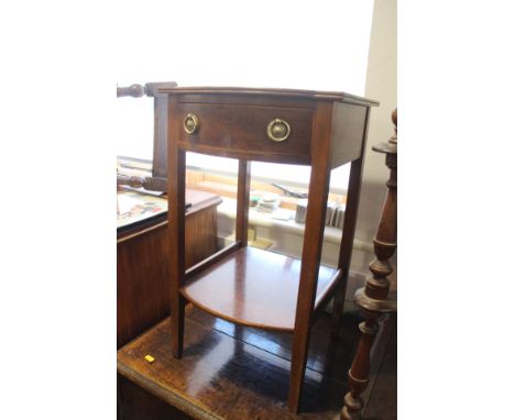 An Edwardian bowfront lamp table, fitted single drawer, on square tapering supports united by an undertier, 14 1/2" wide x 15