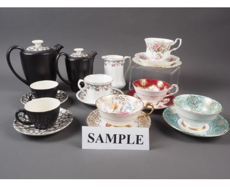 A Royal Albert "Moss Rose" pattern part teaset, a black glazed Poole pottery part coffee set, Paragon teacups and saucers, an