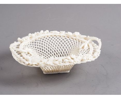 A Belleek latticework bowl with floral decoration, 8" wide