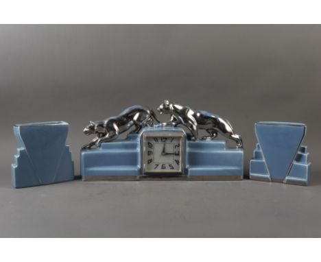 An Art Deco ceramic clock garniture with "silver" panthers, square dial and two vasesClock is 8 1/4" high overall, garnitures