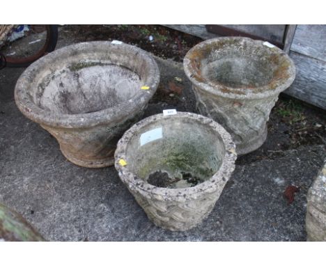 A cast stone tapered planter with latticework decoration, 18" dia, another similar 13" dia, and another 12 1/2" dia