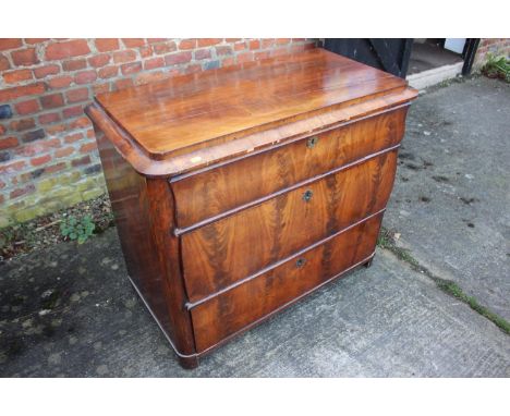 A 19th century Continental figured mahogany commode chest of three drawers with shaped fronts, on bracket feet, 38" wide x 19