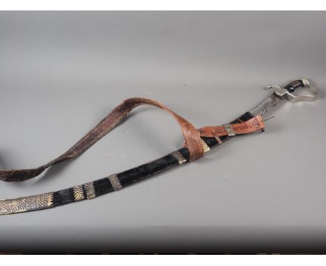 An Ethiopian officer's Wilkinson Sword dress sword, in white metal mounted scabbard, etched and inscribed blade, 30" longPlea