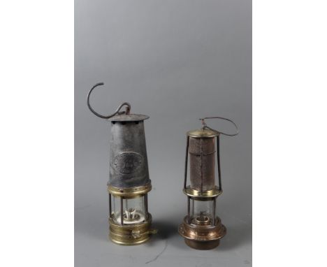 A miner's 19th century Mueseler type safety lamp, 9 1/2" high, and a miner's W E Teal safety lamp, 11" high