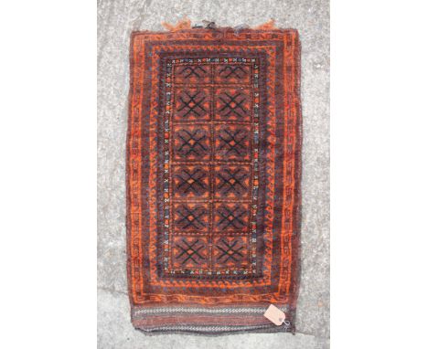 A Persian tribal saddle bag, 10 guls to centre ground, 45" x 25" approx overall