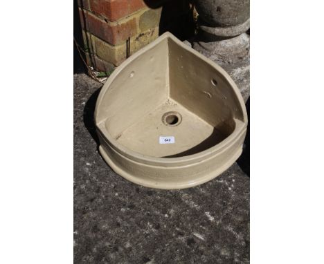 A glazed stoneware corner sink, 14" wide