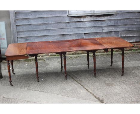 A George III Cuban mahogany Wilkinsons Patent metamorphic/campaign dining table with three extra leaves and brass double mesh